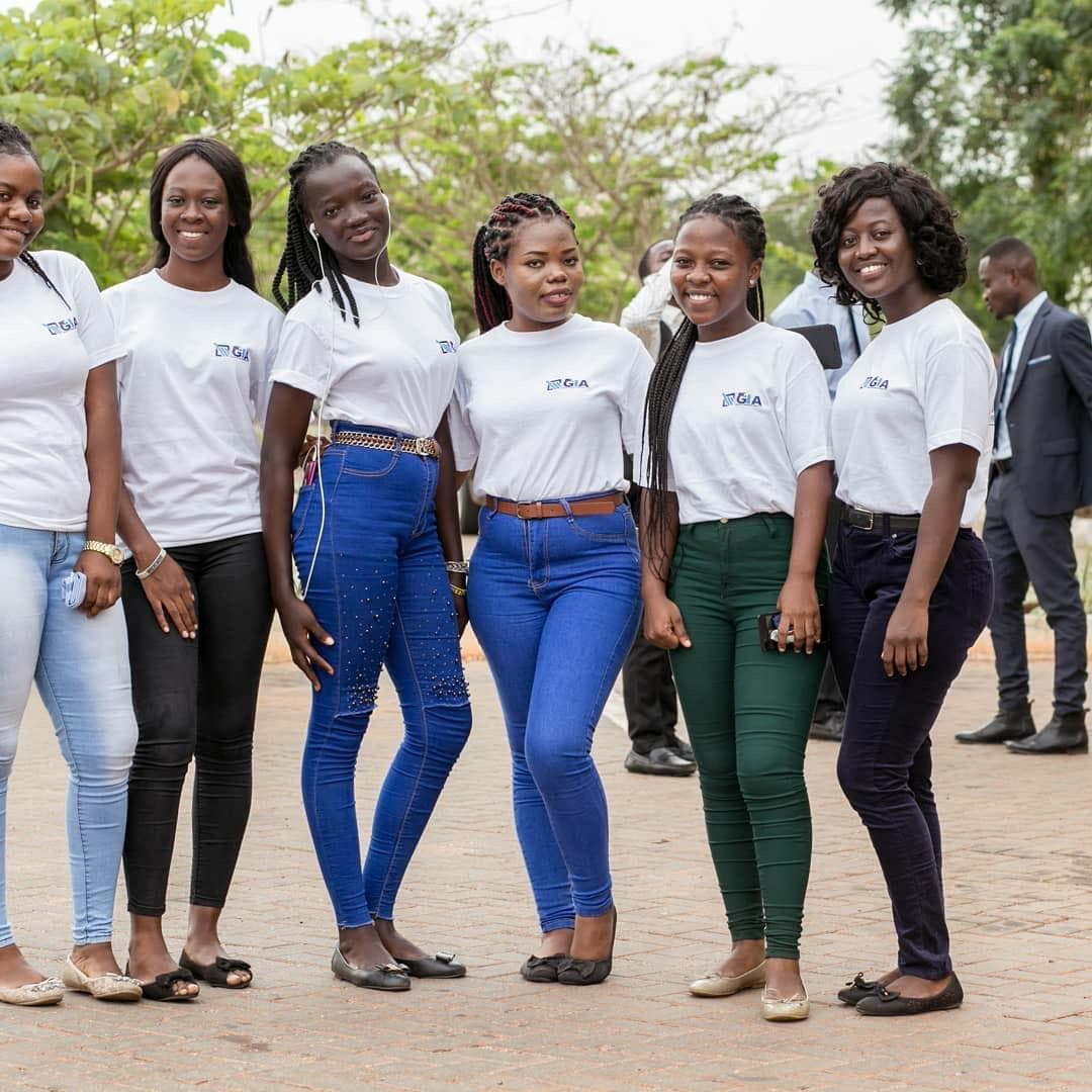 Young women in white GIA T-shirts at the campus launch